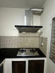 Modern kitchen with stovetop and range hood
