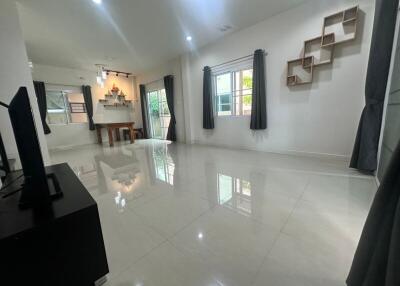 Modern living room with minimalist decor and ample natural light