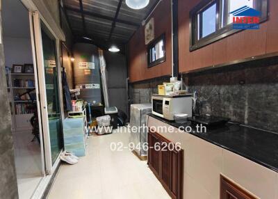 Small kitchen with appliances and storage