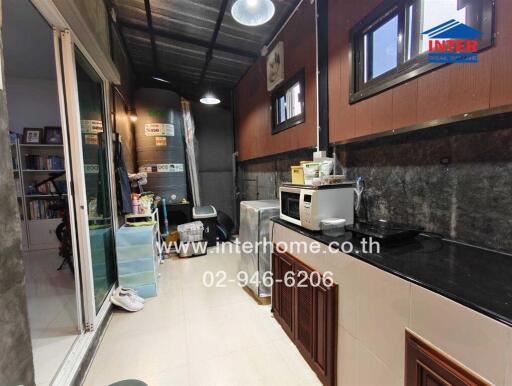 Small kitchen with appliances and storage