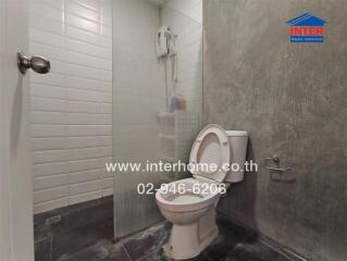 Small bathroom with toilet and shower