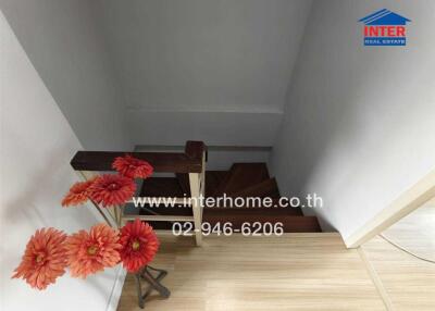 Staircase with flowers and interhome advertisement
