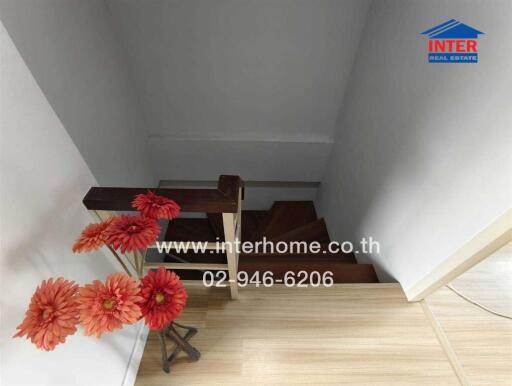 Staircase with flowers and interhome advertisement