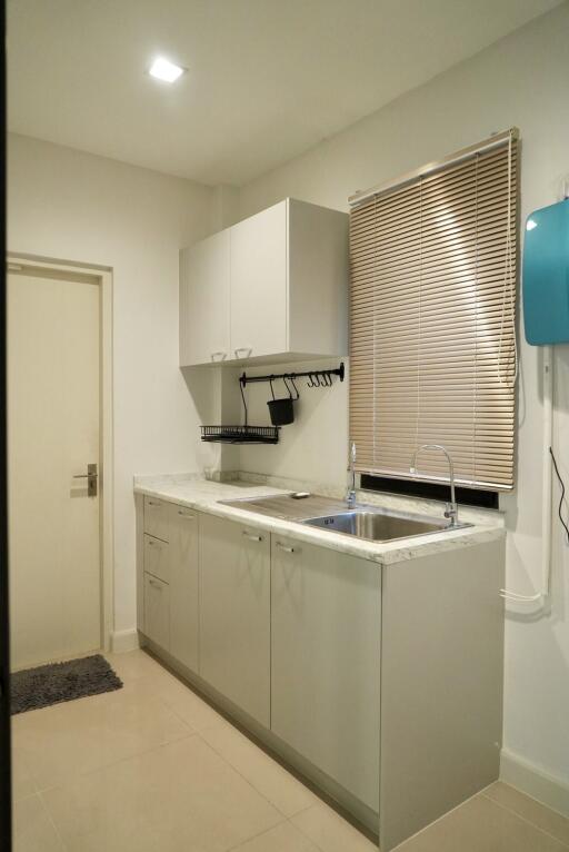 Modern kitchen with cabinets, sink, and countertop