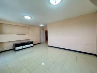 spacious living room with tiled floor