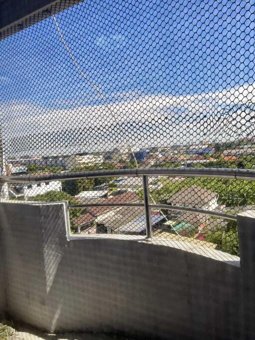 Photograph of a balcony with a view of the surrounding area