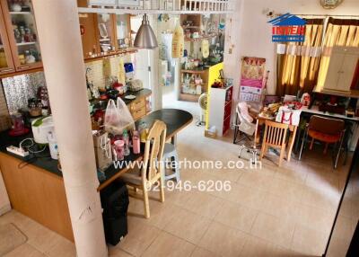Spacious kitchen and dining area with various equipment and decor