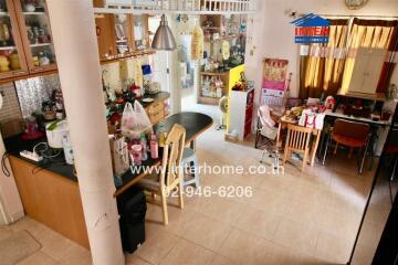 Spacious kitchen and dining area with various equipment and decor