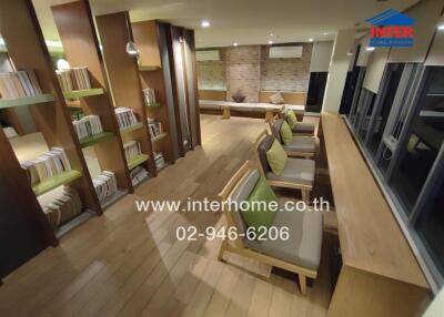 Modern communal area with seating and bookshelves
