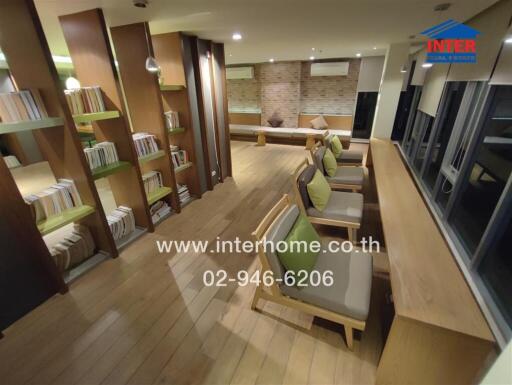 Modern communal area with seating and bookshelves