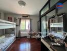 Bedroom with bunk beds and mirrored wardrobe