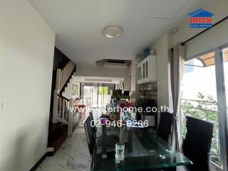 modern living dining area with glass table and large windows