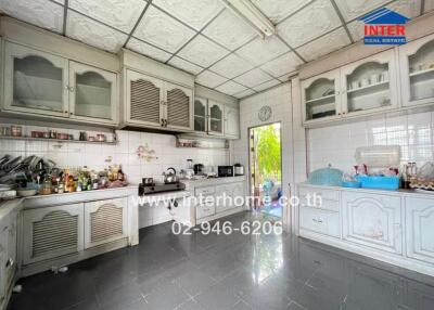 Spacious kitchen with ample storage and appliances