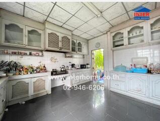 Spacious kitchen with ample storage and appliances