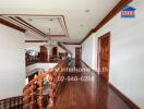 Elegant hallway with wooden floors and a chandelier