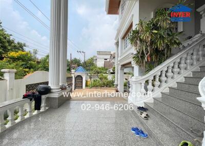 Front view of a building with porch and stairs