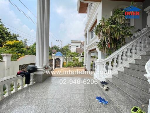 Front view of a building with porch and stairs