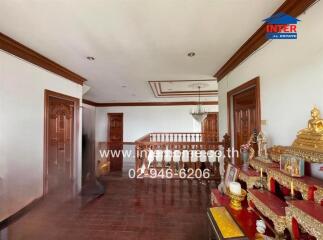 Spacious hallway with wooden accents and traditional decor