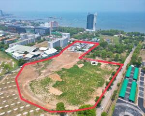 Aerial view of a property plot with red boundary lines
