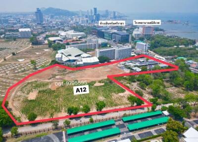 Aerial view of land plot marked A12 within cityscape