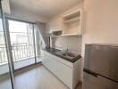 Modern kitchen with balcony access