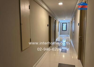 Apartment hallway with tile flooring