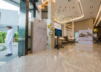 Luxurious building lobby with modern decor and welcoming signs