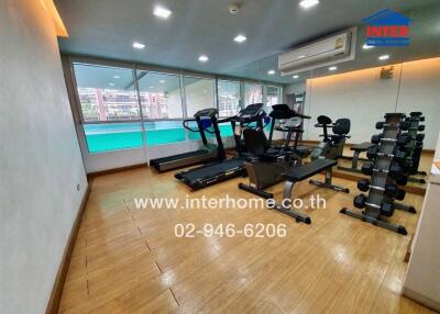 gym with exercise equipment and mirrors