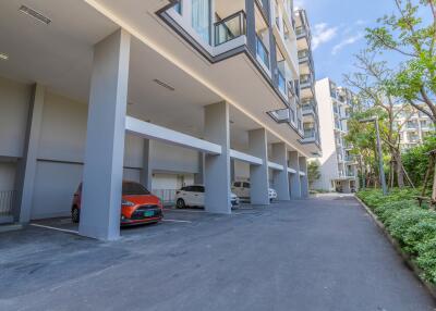 Outdoor parking area and apartment building exterior