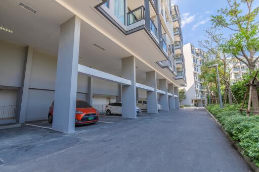 Outdoor parking area and apartment building exterior