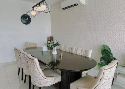 Elegant dining room with wall mounted air conditioner and modern lighting