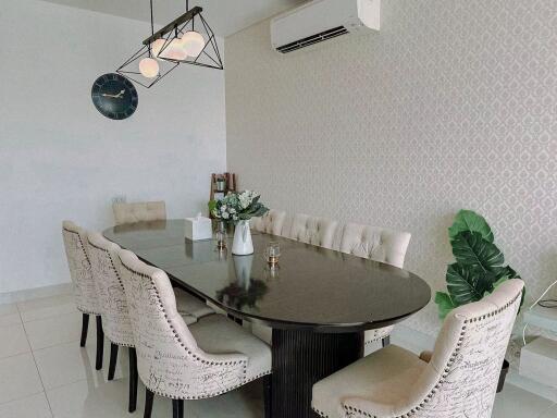 Elegant dining room with wall mounted air conditioner and modern lighting