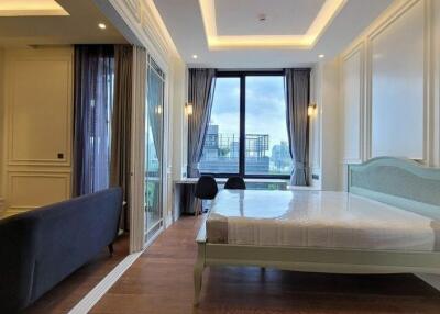 Modern bedroom with large window and city view