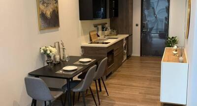 Modern kitchen and dining area with wooden flooring