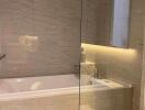 Modern bathroom with glass partition and bathtub