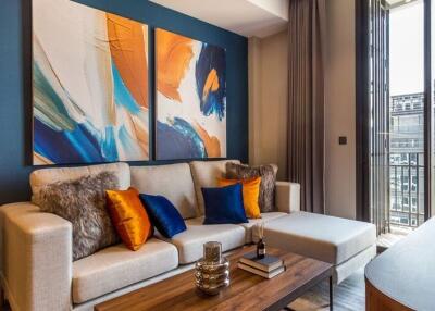 Modern living room with large abstract paintings and cozy seating