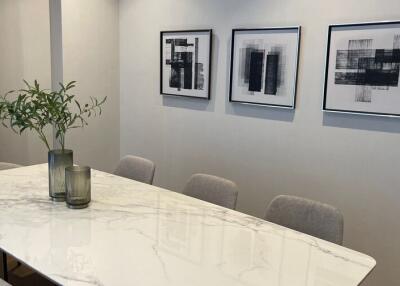 Modern dining area with minimalist decor and a marble table