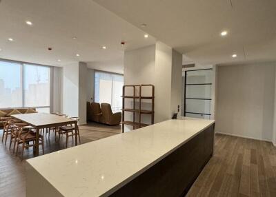 Open living and dining area with a kitchen island