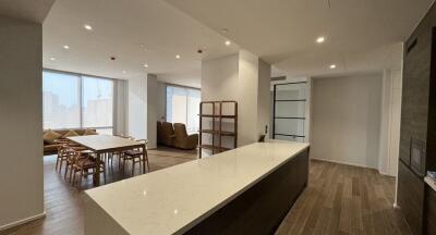 Open living and dining area with a kitchen island