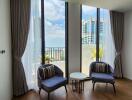 Living room with large windows and city view