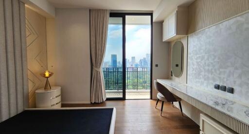 Modern bedroom with a large window and city view