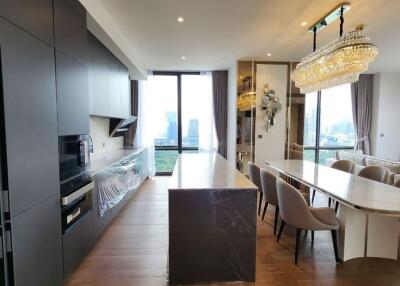 Modern kitchen with dining area and city view