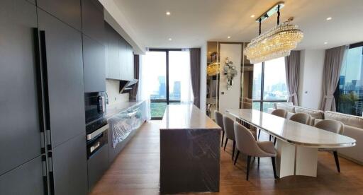 Modern kitchen with dining area and city view