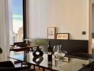 Elegant dining area with a view into a bedroom