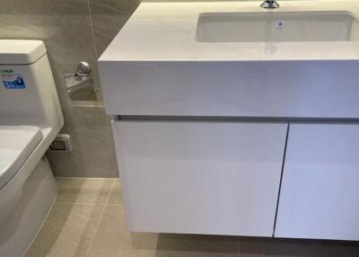 Modern bathroom with white toilet and vanity