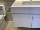 Modern bathroom with white toilet and vanity