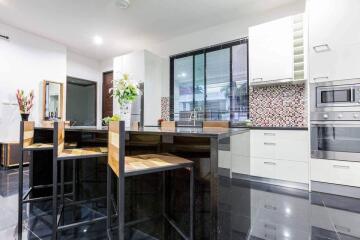 Modern kitchen with sleek design and island seating