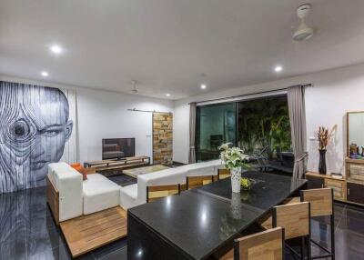 Modern living room with large mural and sliding glass doors