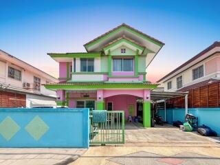 Two-story house with colorful exterior