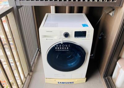 Laundry area with Samsung washer
